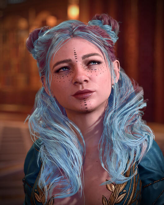 Formal portrait of Ravioli from the chest up. She is wearing a fancy teal dress and her hair is down around her shoulders in waves.